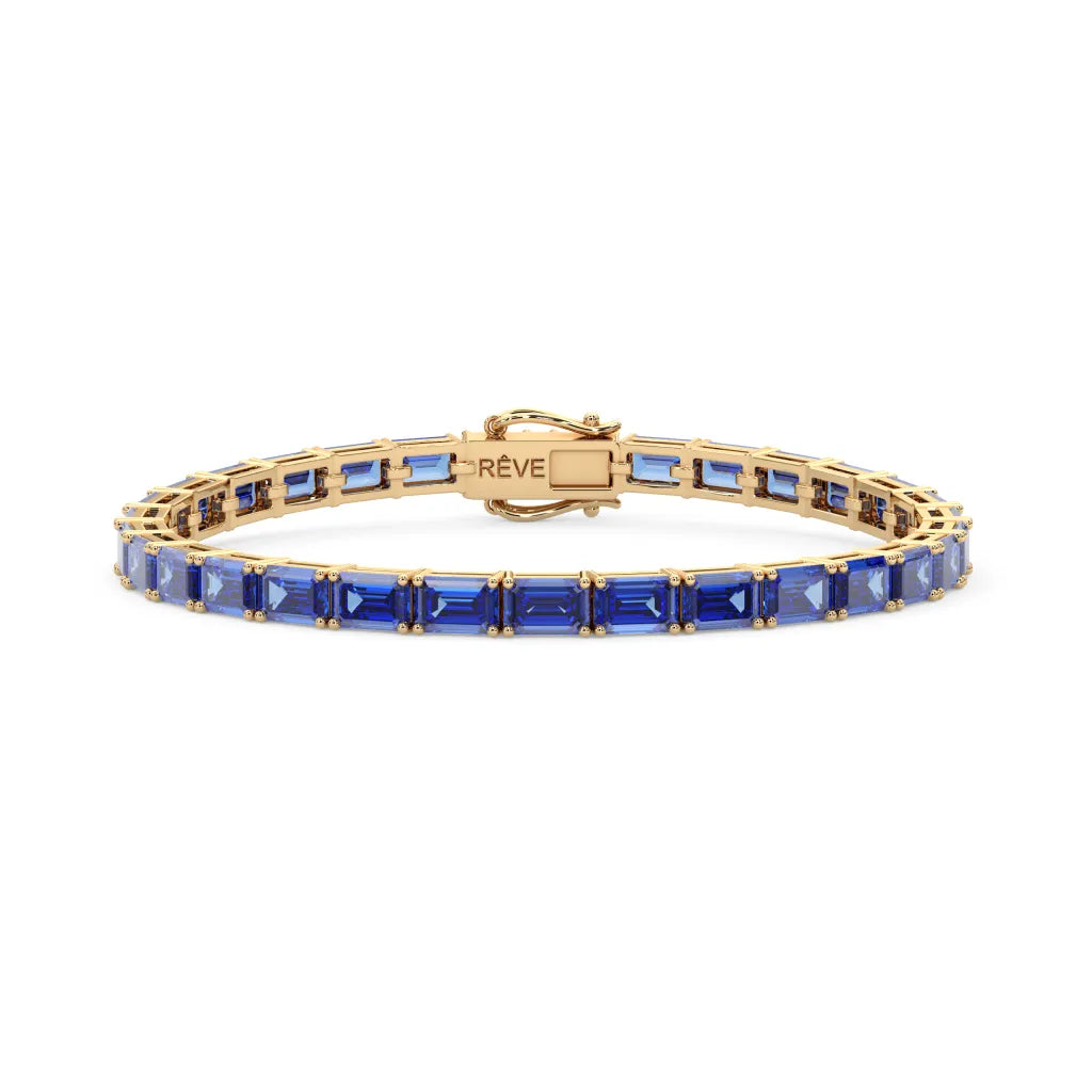 Tennisarmband mit smaragdgeschliffenem (6x4mm) kornblumenblauem Laborsaphir in 18 Karat Gelbgold-Vermeil