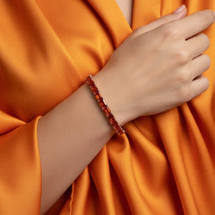 Tennisarmband mit smaragdgeschliffenem (6x4mm) orangefarbenem Laborsaphir in 18K Roségold-Vermeil