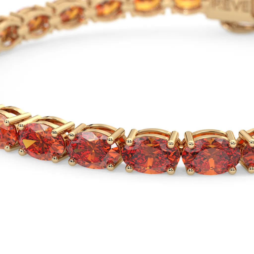 Bracelet de tennis ovale en saphir orange de laboratoire, monté sur vermeil en or jaune 18 carats