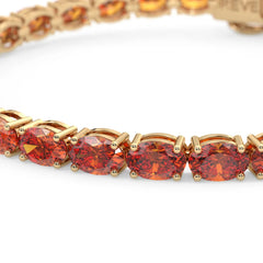 Bracelet de tennis ovale en saphir orange de laboratoire, monté sur vermeil en or jaune 18 carats