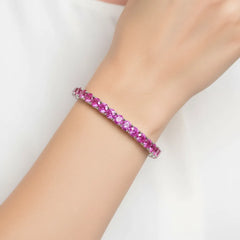 Rundes (4 mm) pinkfarbenes Laborsaphir-Tennisarmband aus 18-karätigem Weißgold-Vermeil