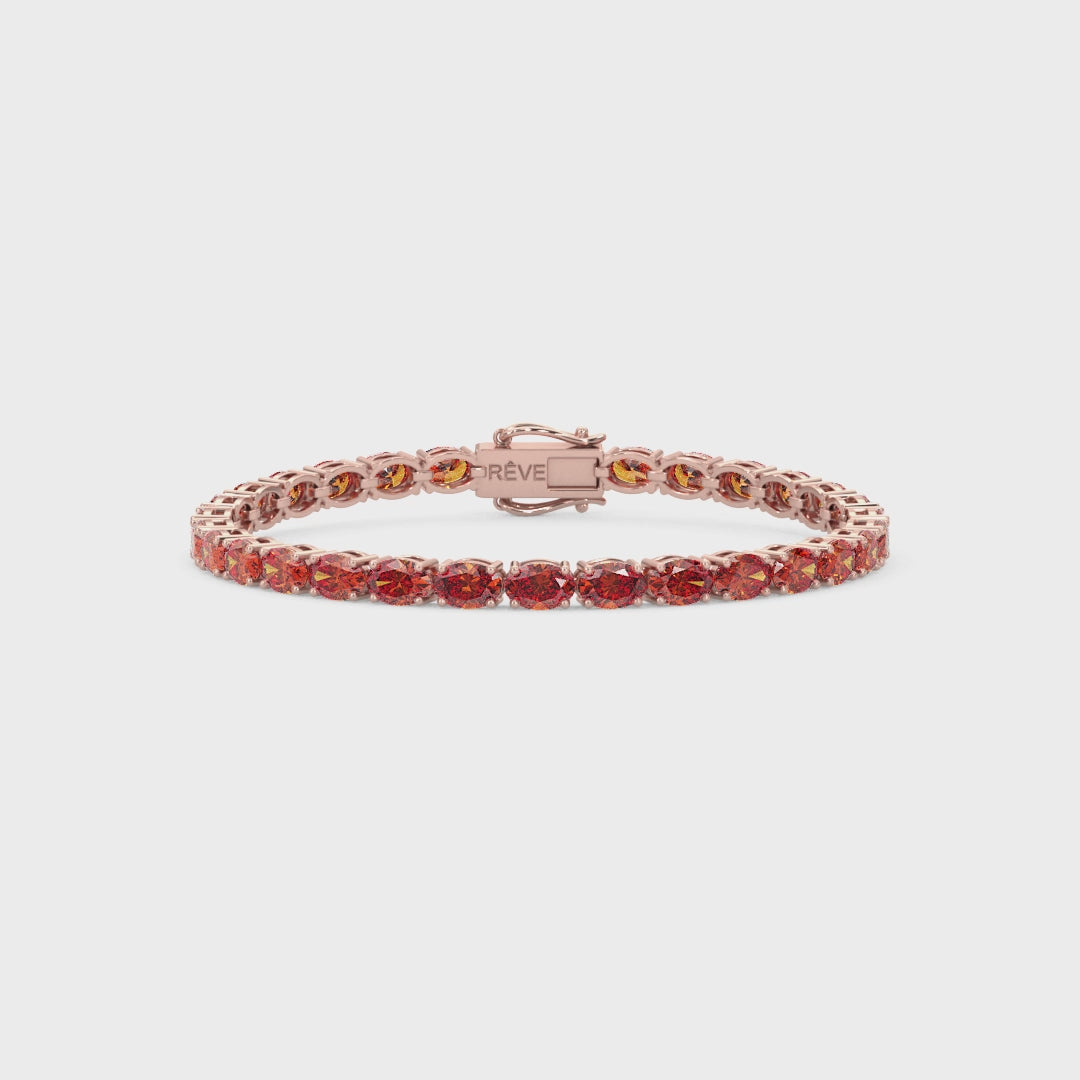 Bracelet de tennis ovale en saphir orange de laboratoire, monté sur vermeil en or rose 18 carats